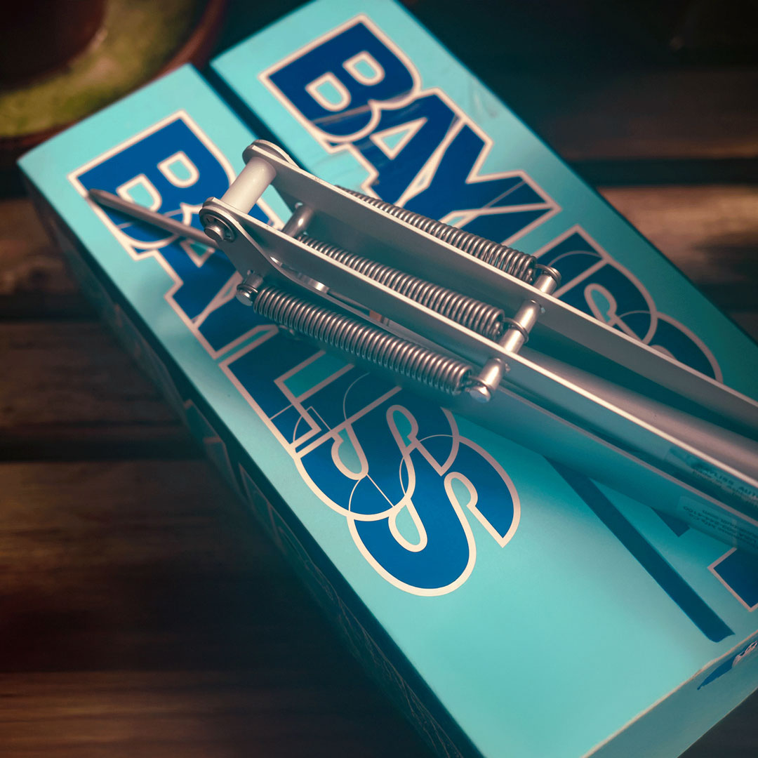 Metallic fishing hook with springs on a Bayliner box