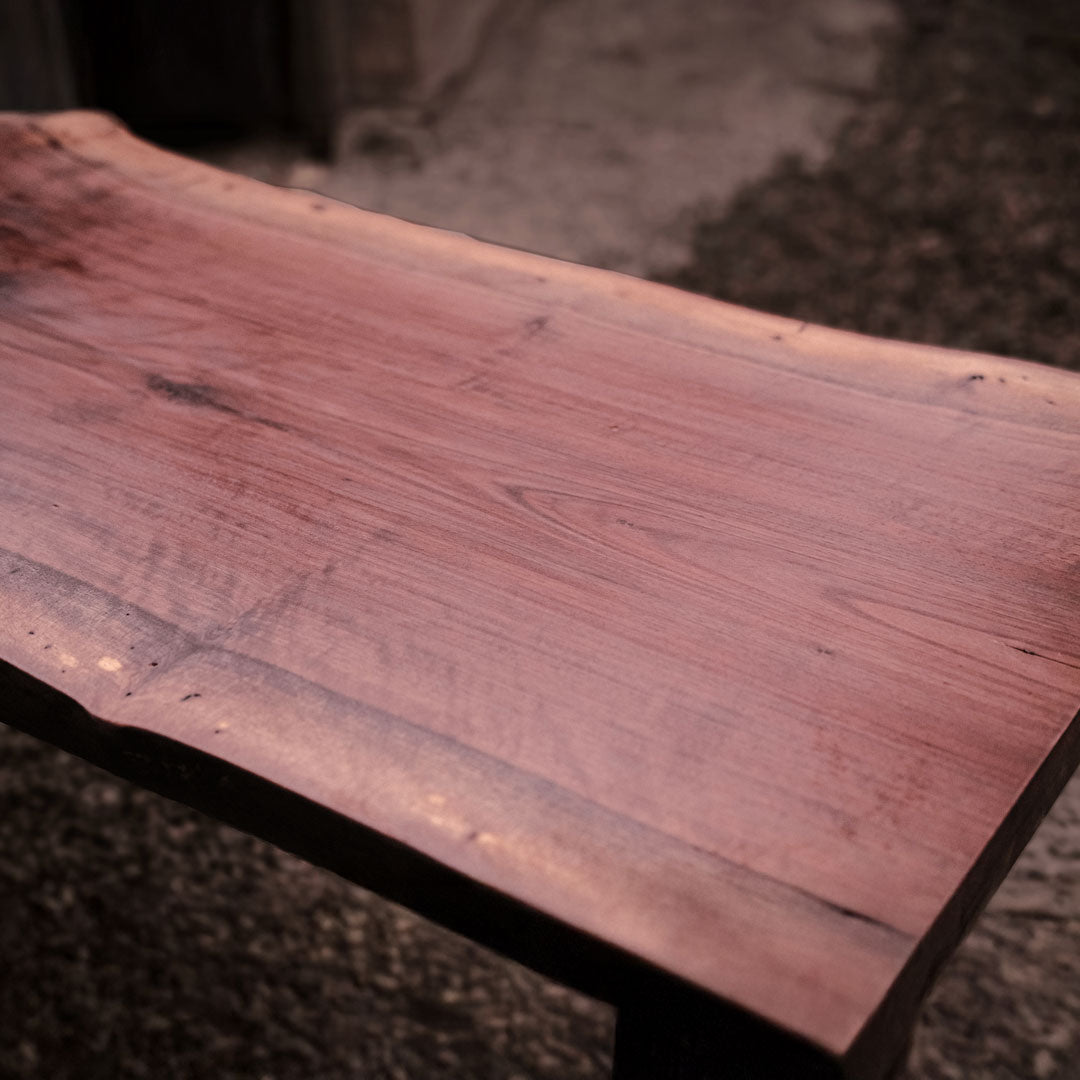 Close-up of a wooden surface with a blurred background