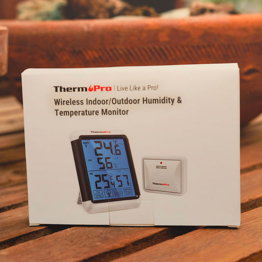 Thermopro temperature and humidity monitor packaging on a wooden surface