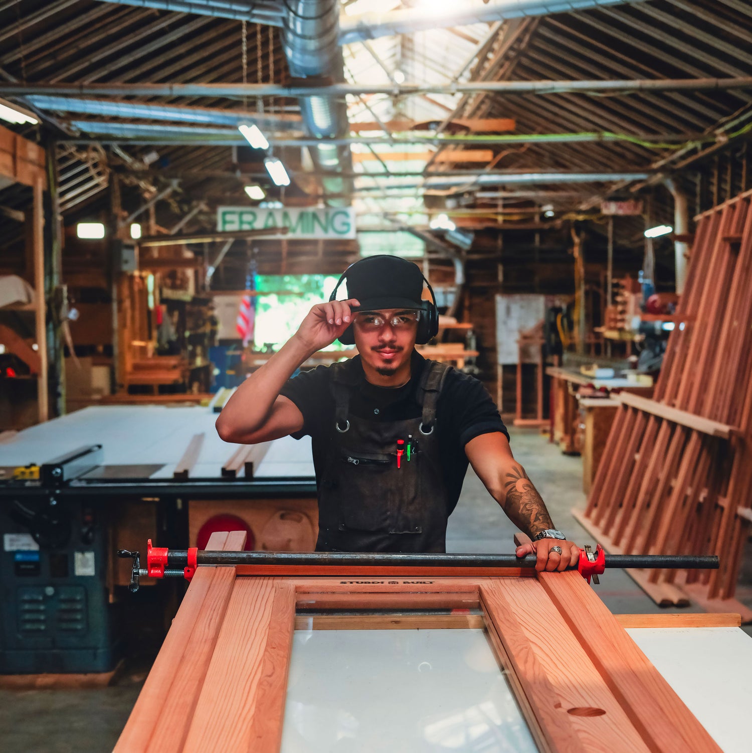 Man working with wooden frames in a workshop