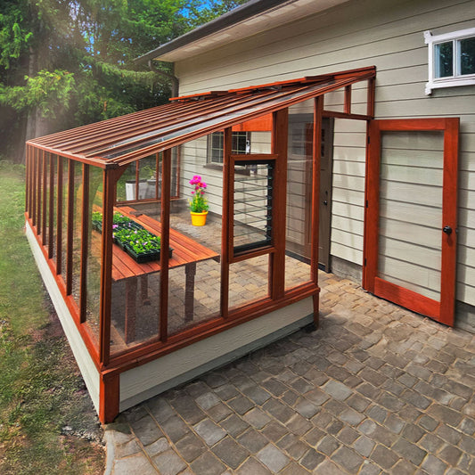 Greenhouse solarium attached to house for gardening and sitting.